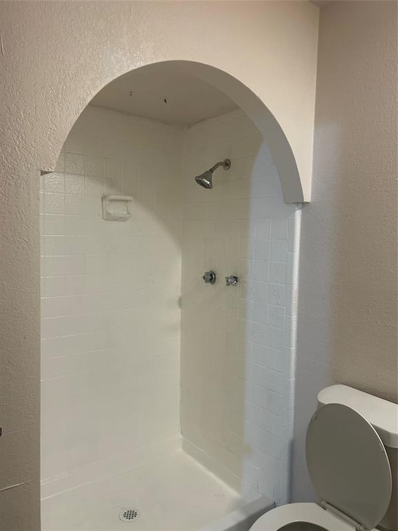 2043 Chestnut Road Carrollton, TX 75007 - Photo 19 of 19 a bathroom with a toilet and a shower