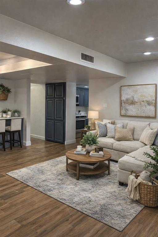 2043 Chestnut Road Carrollton, TX 75007 - Photo 3 of 19 a living room with furniture and a wooden floor