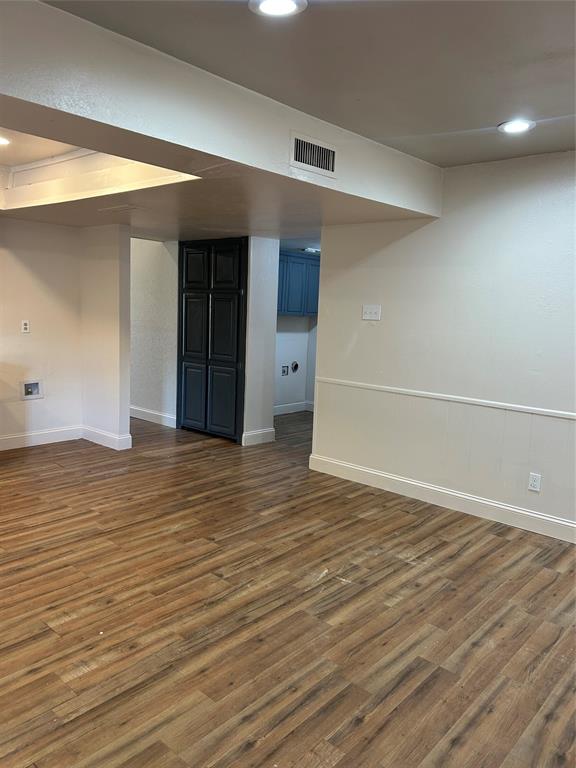 2043 Chestnut Road Carrollton, TX 75007 - Photo 10 of 19 an empty room with wooden floor and windows