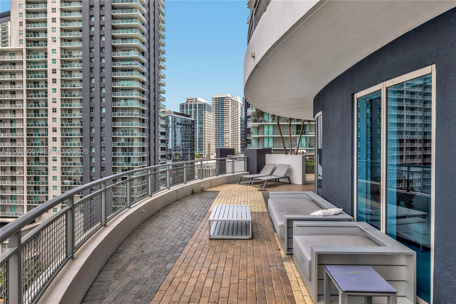 60 Southwest 13th Street, Unit 1124 Miami, FL 33130 - Photo 21 of 30 a view of balcony with a couple of large trees