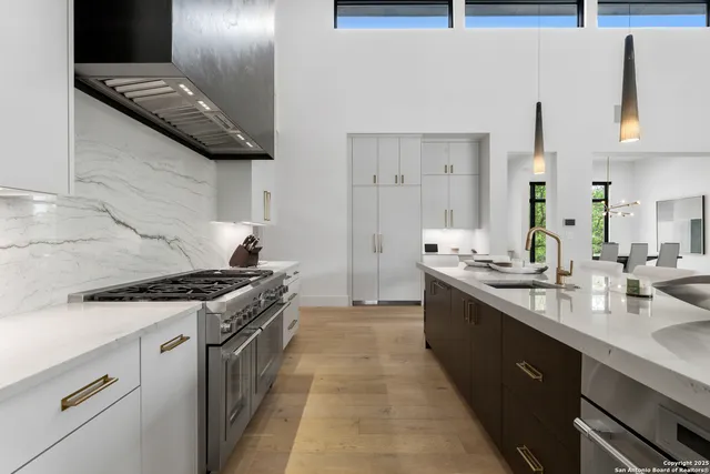 a kitchen with a stove and a sink