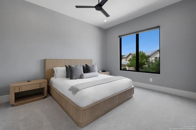 a large white bed in a white room