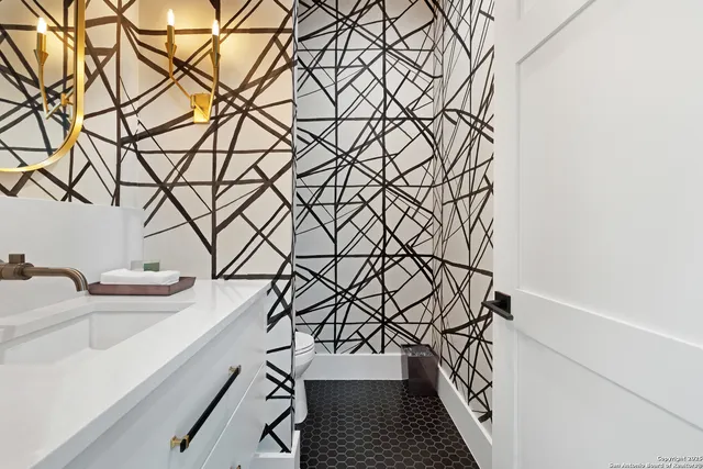 a white bath tub sitting next to a white wall and a shower curtain