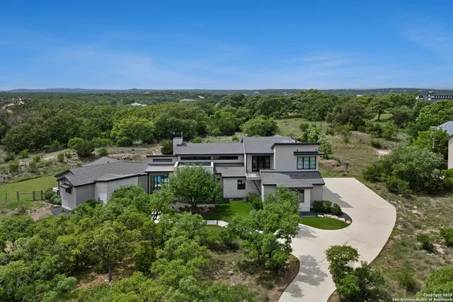 an aerial view of a house with a garden