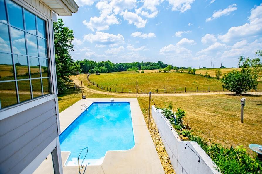 575 Liberty Church Road Carrollton, GA 30116 - Photo 69 of 95 a view of a swimming pool with a lounge chairs