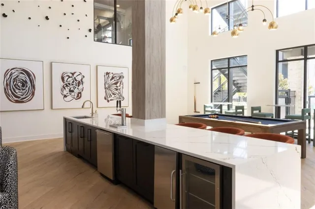 a large bathroom with a sink and a large mirror