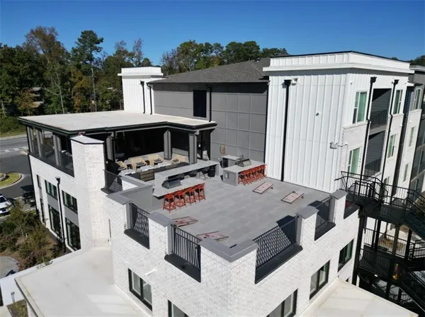 a view of a dinning table and chairs in the patio