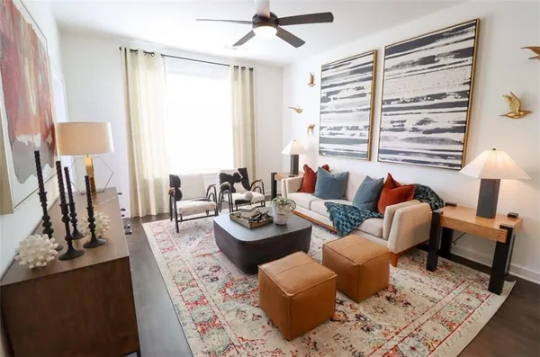 a living room with furniture and a large window