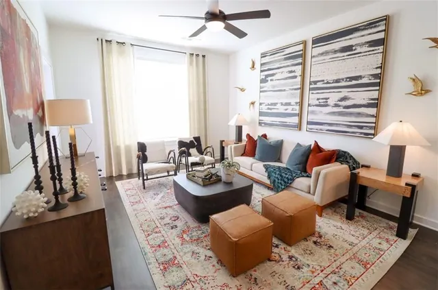a living room with furniture and a large window