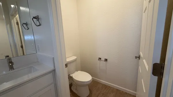 a bathroom with a sink and vanity