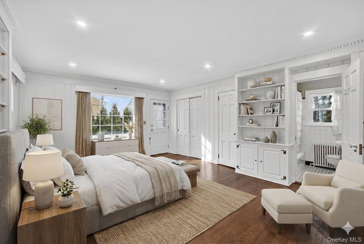 30 Argyle Road Rye Brook, NY 10573 - Photo 12 of 48 a spacious bedroom with a bed and a couch