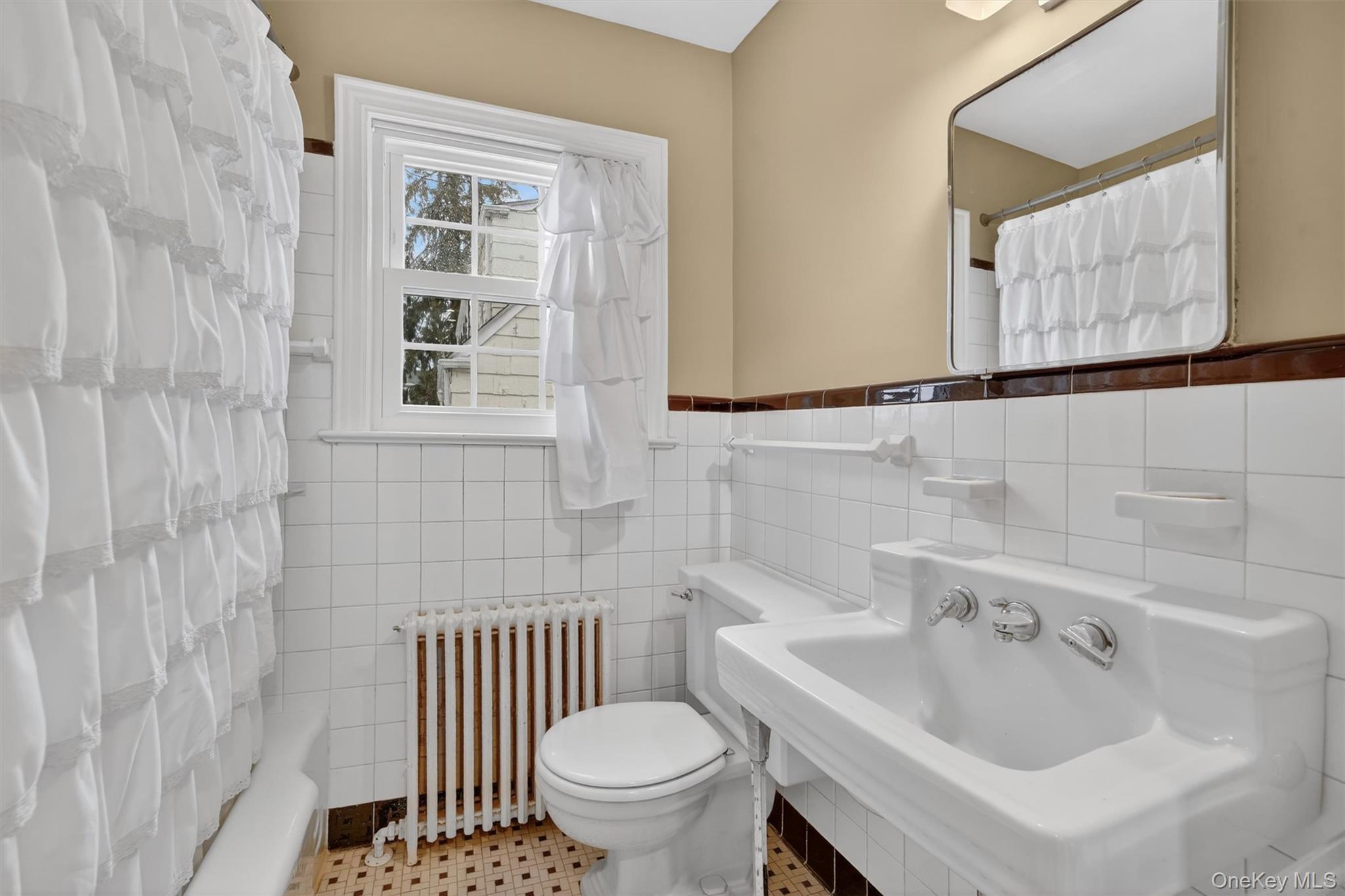 30 Argyle Road Rye Brook, NY 10573 - Photo 16 of 48 a bathroom with a sink and a toilet