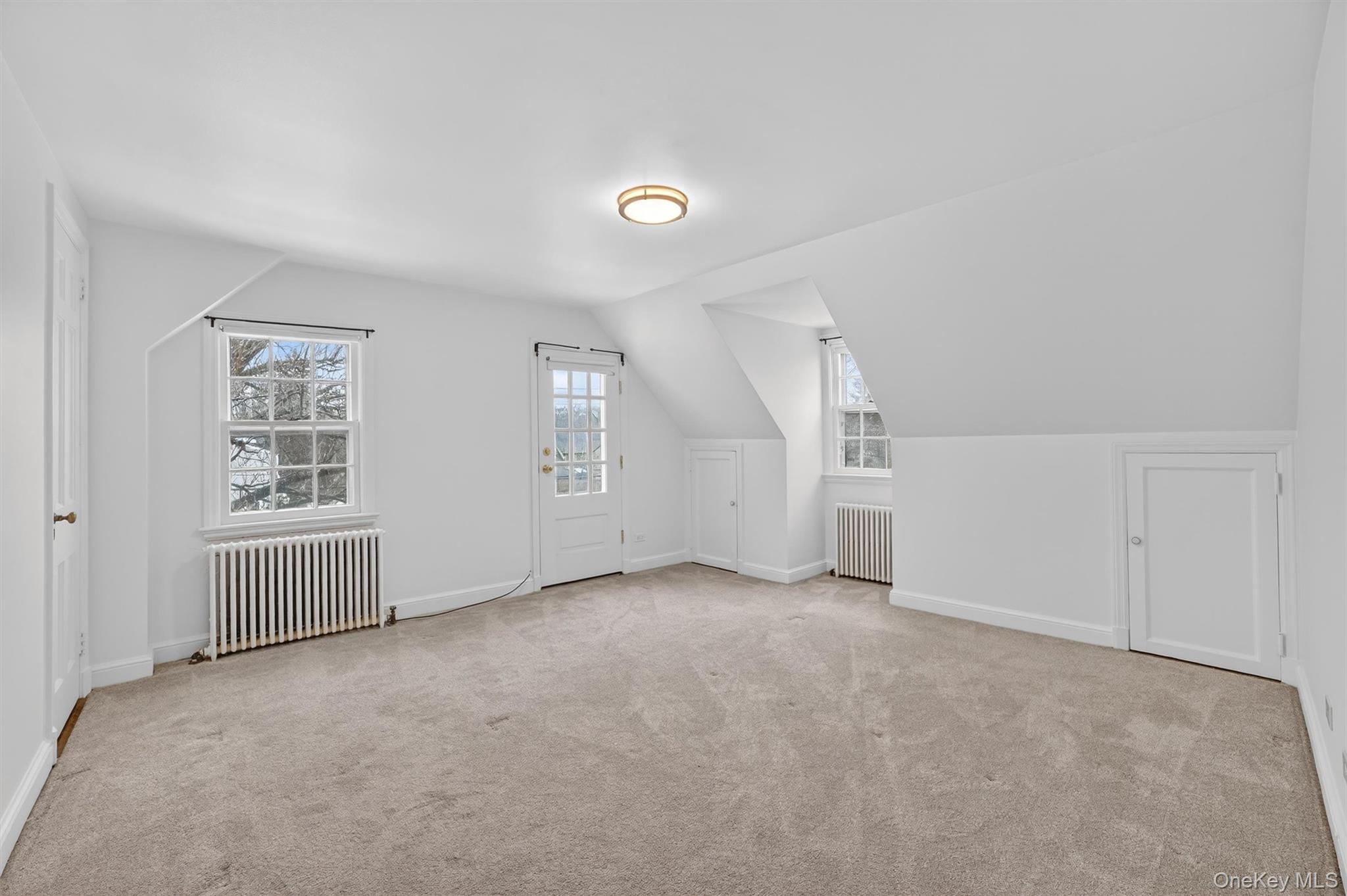 30 Argyle Road Rye Brook, NY 10573 - Photo 18 of 48 an empty room with windows and pillars in it