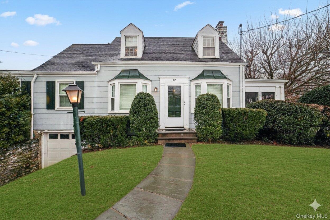 30 Argyle Road Rye Brook, NY 10573 - Photo 2 of 48 a front view of a house with a yard