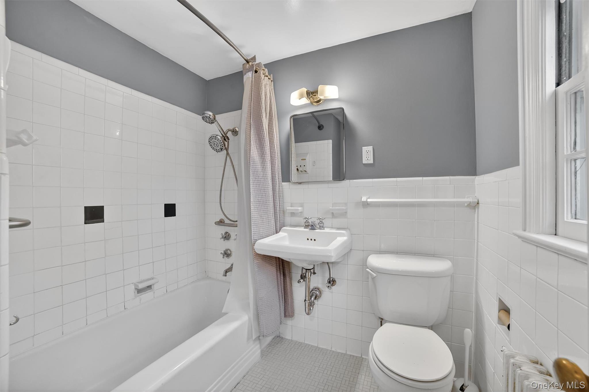 30 Argyle Road Rye Brook, NY 10573 - Photo 24 of 48 a bathroom with a sink a toilet and shower