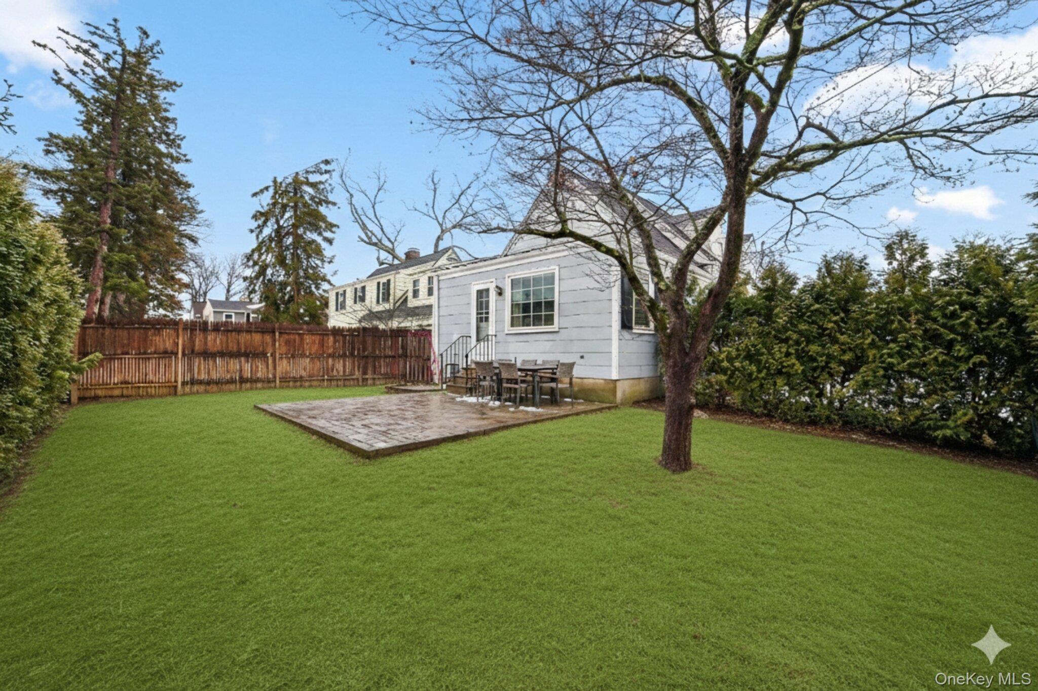 30 Argyle Road Rye Brook, NY 10573 - Photo 30 of 48 a view of a house with backyard and a tree