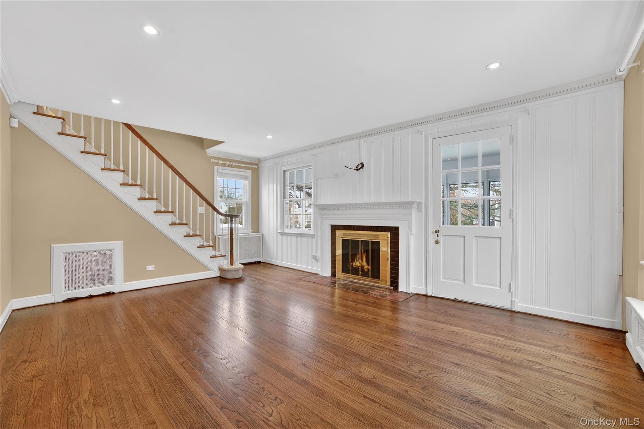30 Argyle Road Rye Brook, NY 10573 - Photo 5 of 48 a view of an empty room with wooden floor fireplace and a window