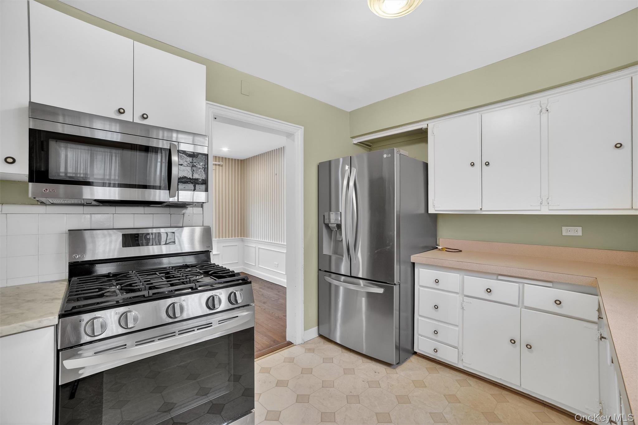 30 Argyle Road Rye Brook, NY 10573 - Photo 9 of 48 a kitchen with cabinets stainless steel appliances and wooden cabinets