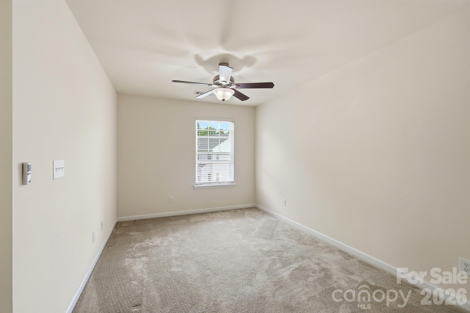 175 Limerick Road, Unit B Mooresville, NC 28115 - Photo 17 of 30 an empty room with windows and fan