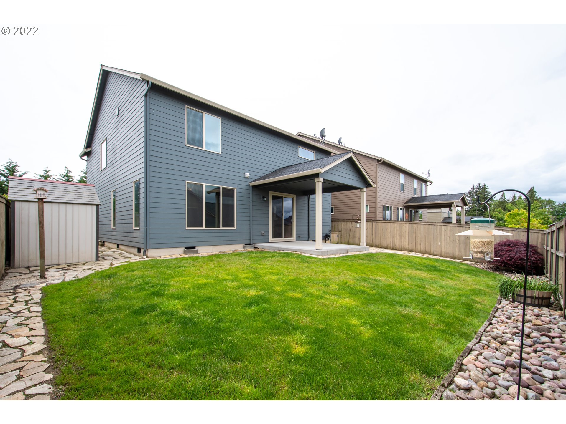 2312 South Wind River Way Ridgefield, WA 98642 - Photo 29 of 30 a backyard of a house with table and chairs