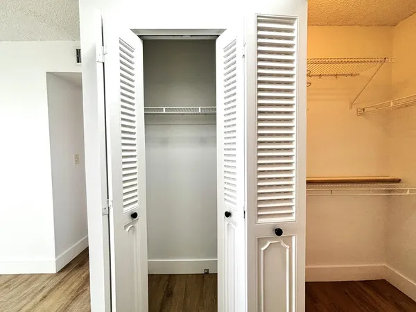 a bathroom with a sink vanity and a mirror