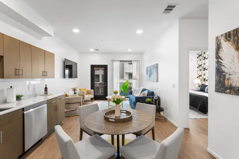 a view of a dining room with furniture and wooden floor