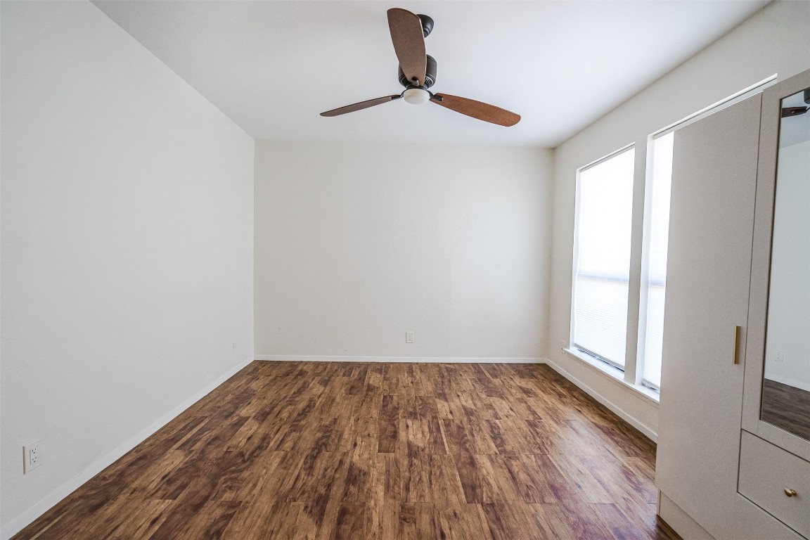2106 Lamplight Village Circle, Unit A Austin, TX 78727 - Photo 12 of 19 a view of empty room with wooden floor and fan