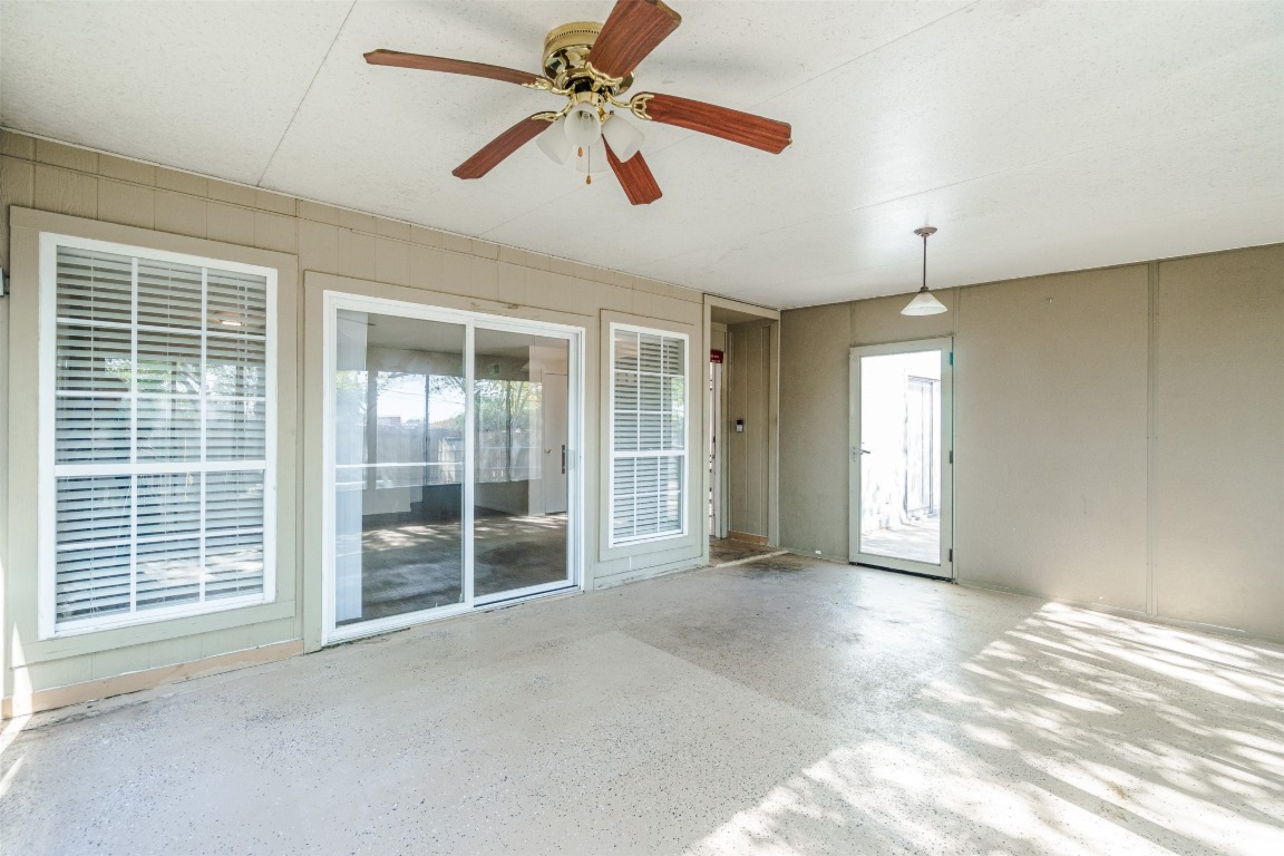 2106 Lamplight Village Circle, Unit A Austin, TX 78727 - Photo 14 of 19 a view of a livingroom with a ceiling fan and window