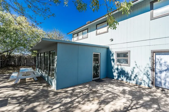 a backyard of a house with seating space