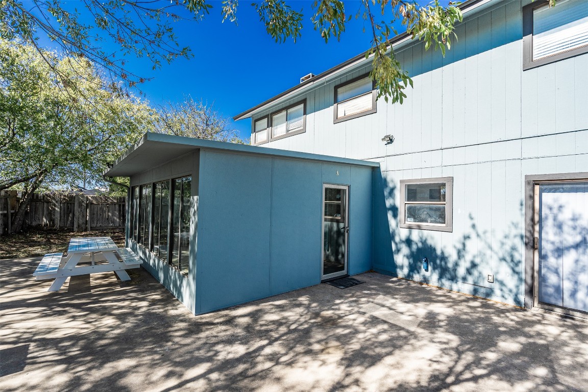 2106 Lamplight Village Circle, Unit A Austin, TX 78727 - Photo 16 of 19 a backyard of a house with seating space