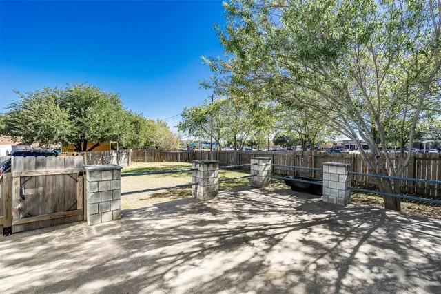 a view of a backyard with sitting area