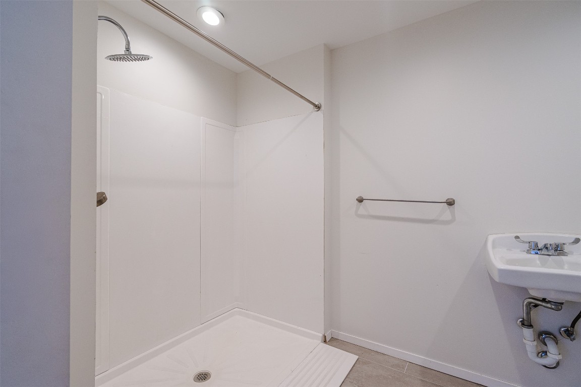 2106 Lamplight Village Circle, Unit A Austin, TX 78727 - Photo 10 of 19 a bathroom with a sink and a mirror