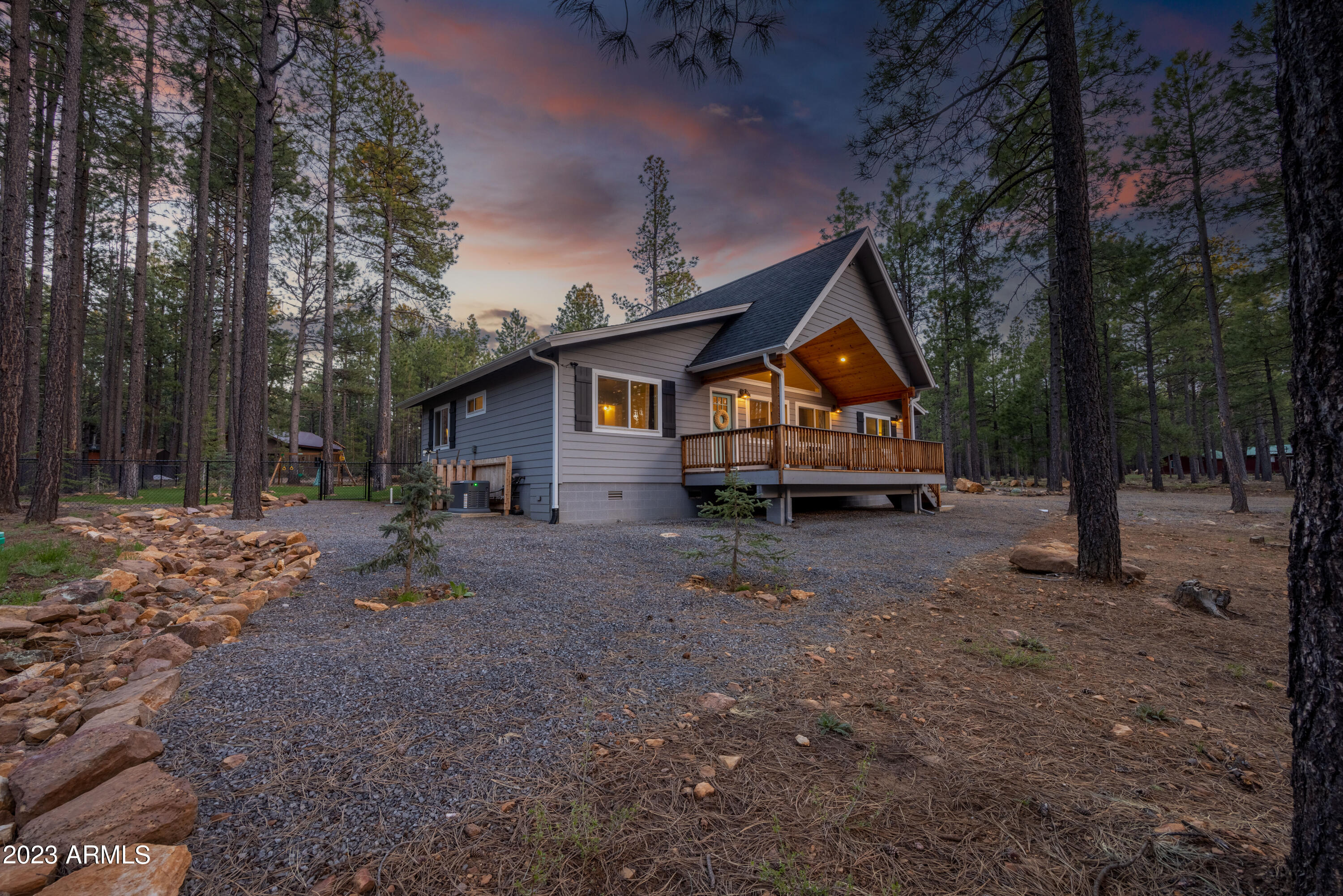 2772 Larson Loop Forest Lakes, AZ 85931 - Photo 62 of 65 a view of house with backyard and trees