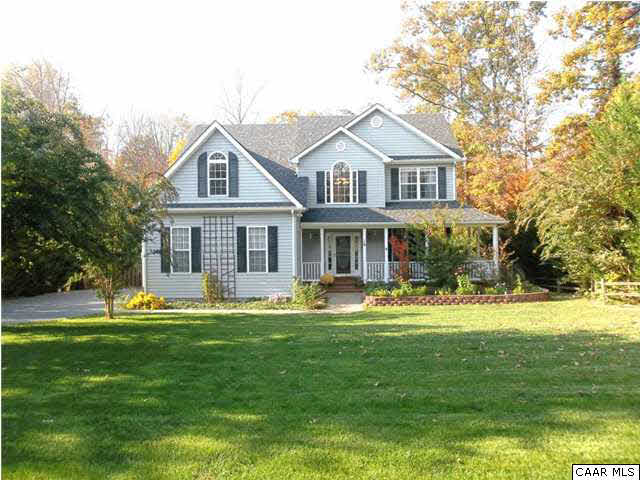 16 Vine Ridge Drive Palmyra, VA 22963 - Photo 2 of 30 a front view of a house with a garden and trees