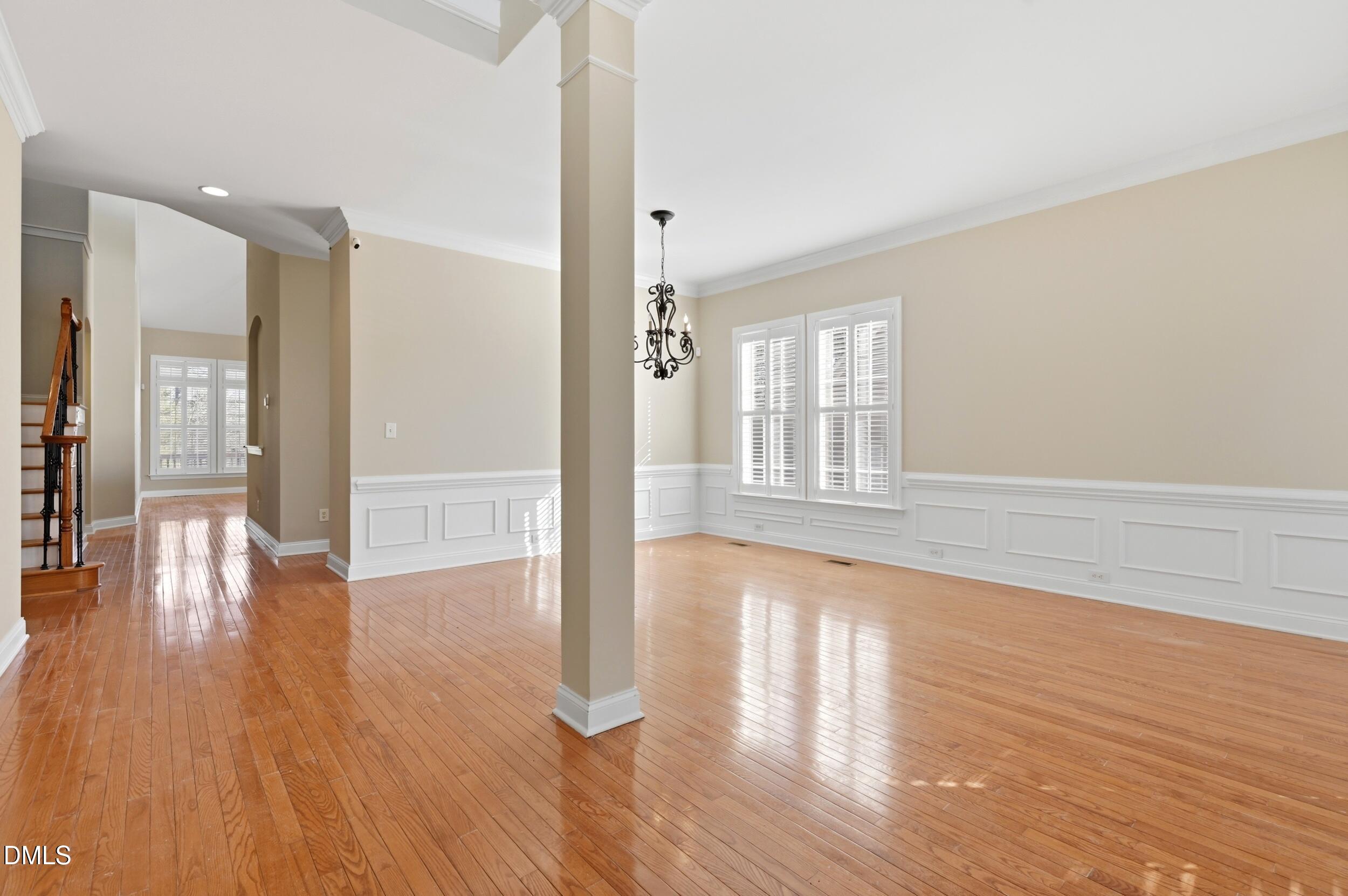 4803 Marena Place Durham, NC 27707 - Photo 4 of 42 a view of an empty room with wooden floor and a window