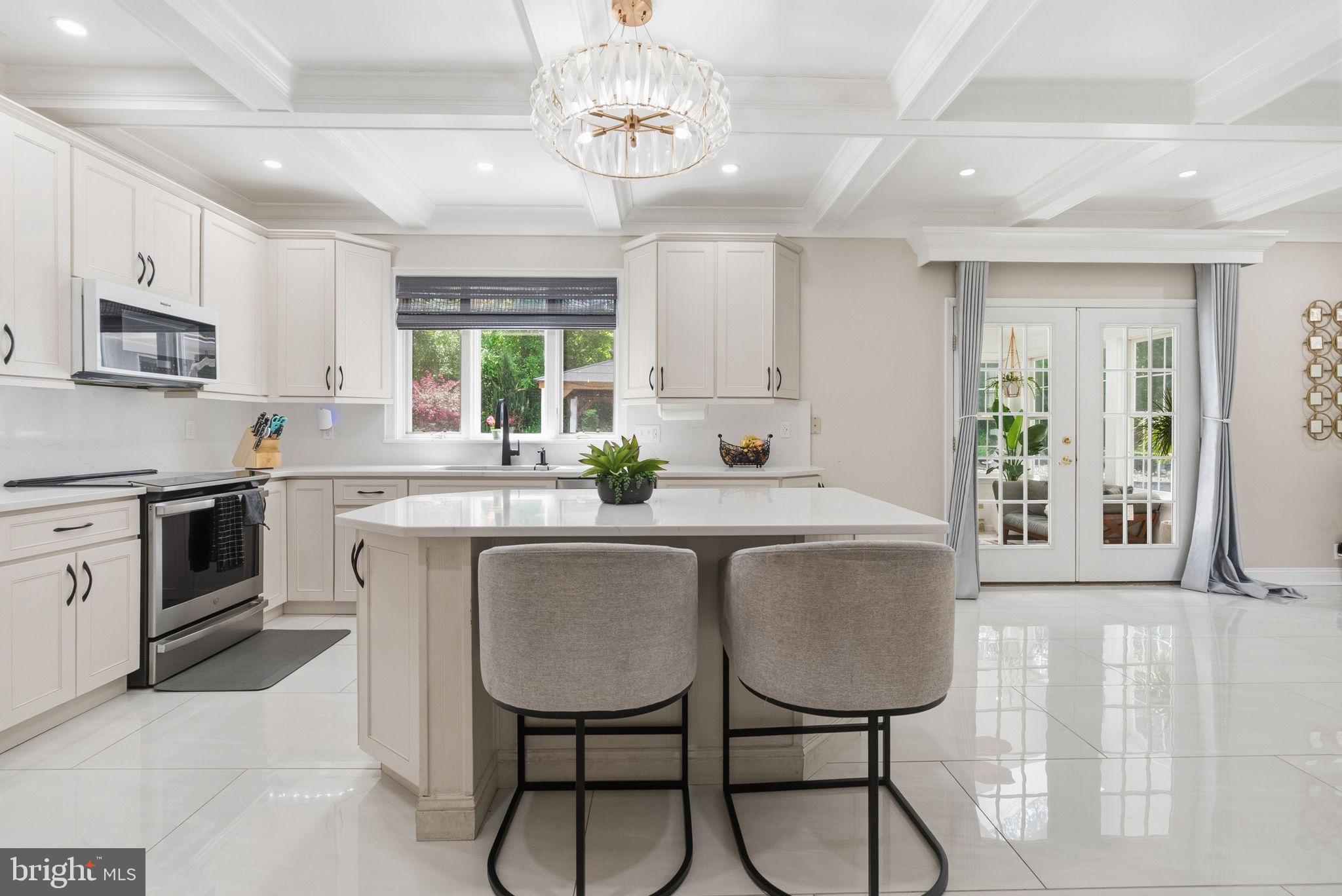 1350 Skelp Level Road Downingtown, PA 19335 - Photo 12 of 50 a kitchen with stainless steel appliances granite countertop a stove a sink dishwasher a microwave oven and a dining table with wooden floor