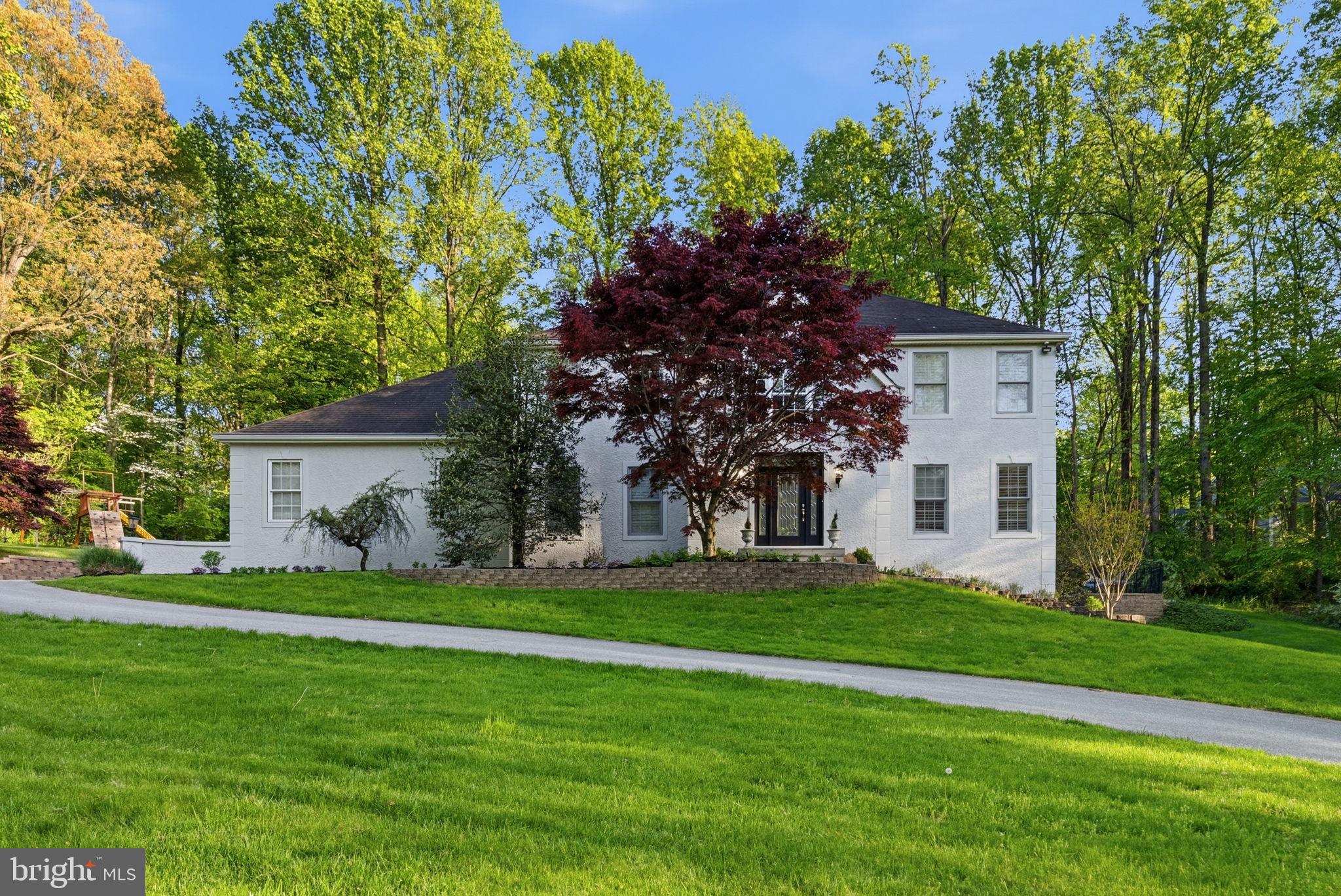 1350 Skelp Level Road Downingtown, PA 19335 - Photo 2 of 50 a front view of a house with a garden