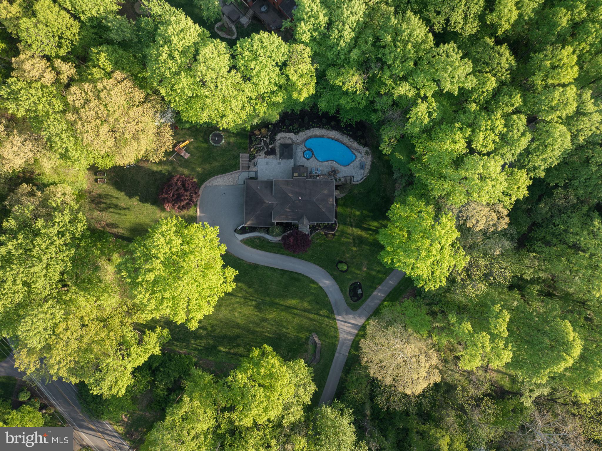 1350 Skelp Level Road Downingtown, PA 19335 - Photo 43 of 50 a backyard of a house with a yard basket ball court