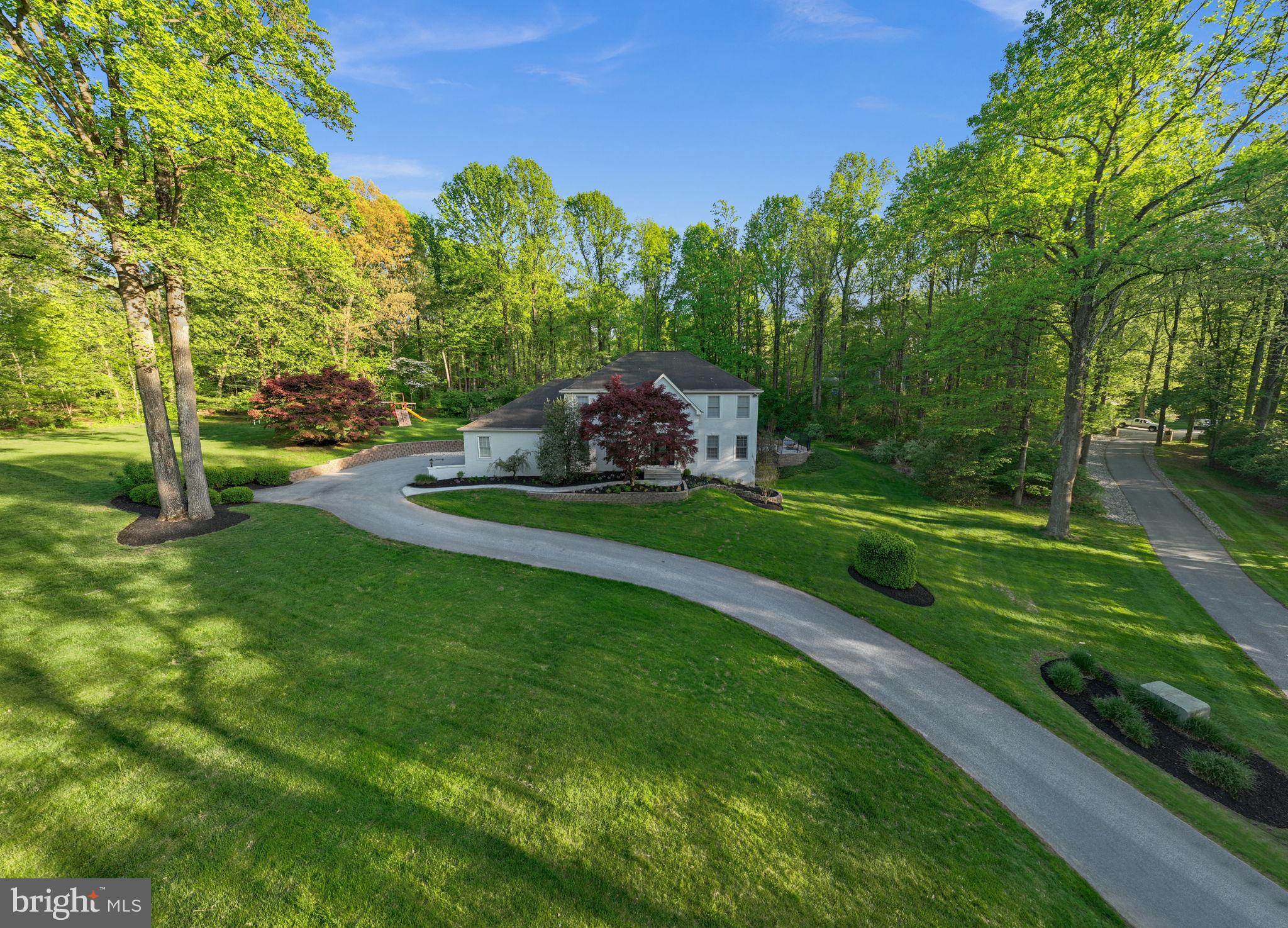 1350 Skelp Level Road Downingtown, PA 19335 - Photo 45 of 50 a view of a garden with a house in the background