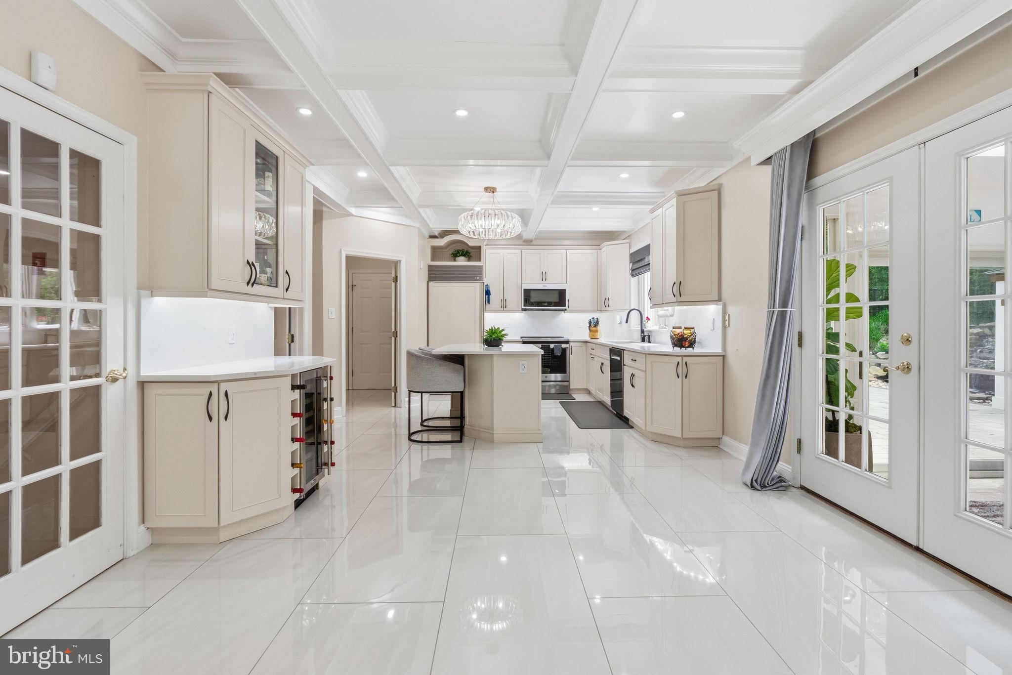 1350 Skelp Level Road Downingtown, PA 19335 - Photo 7 of 50 a large white kitchen with lots of counter space and windows