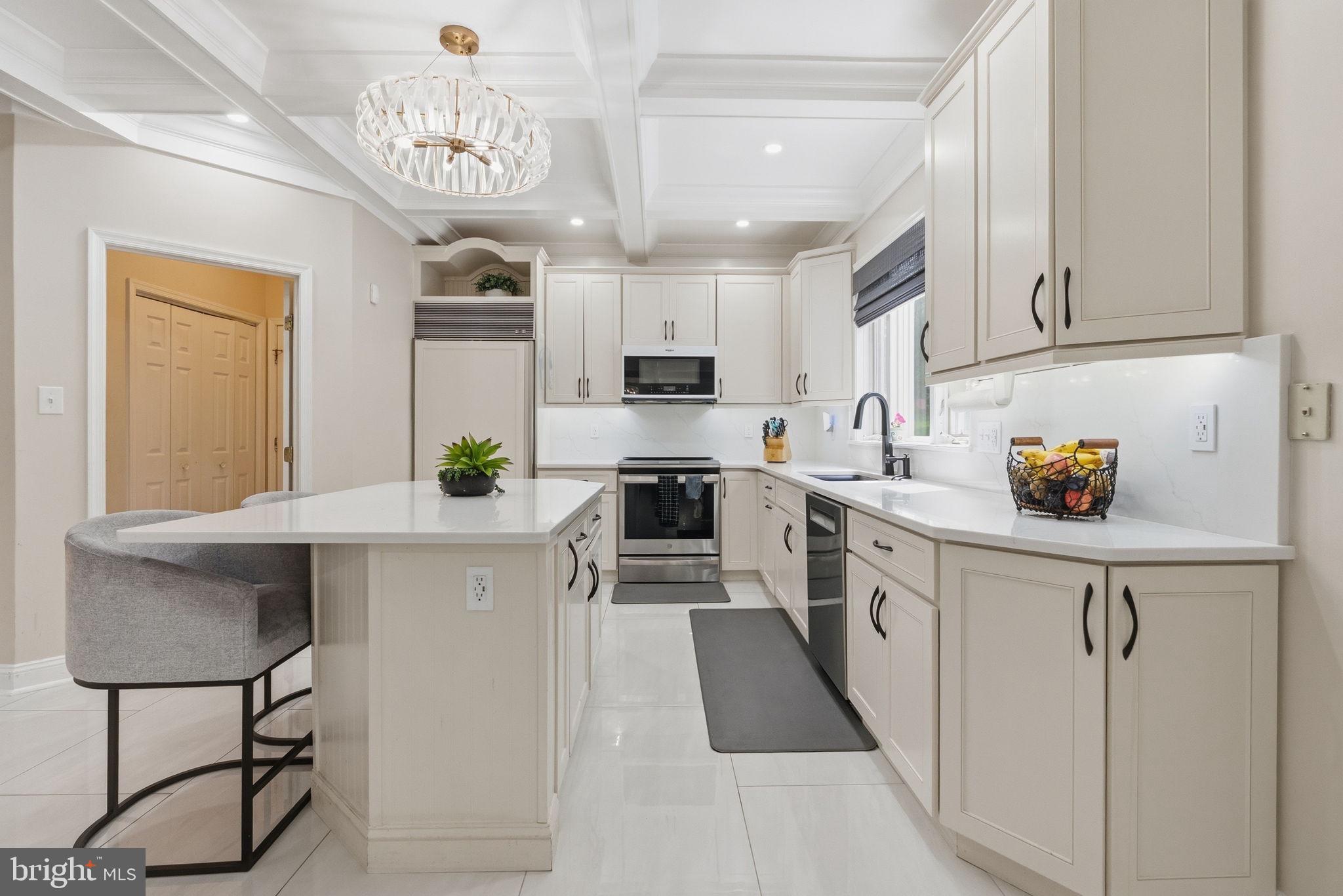 1350 Skelp Level Road Downingtown, PA 19335 - Photo 9 of 50 a kitchen with stainless steel appliances granite countertop a sink a stove a refrigerator cabinets and chairs