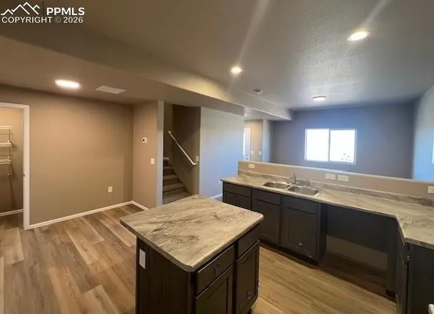 a kitchen with stainless steel appliances granite countertop a sink and stove top oven