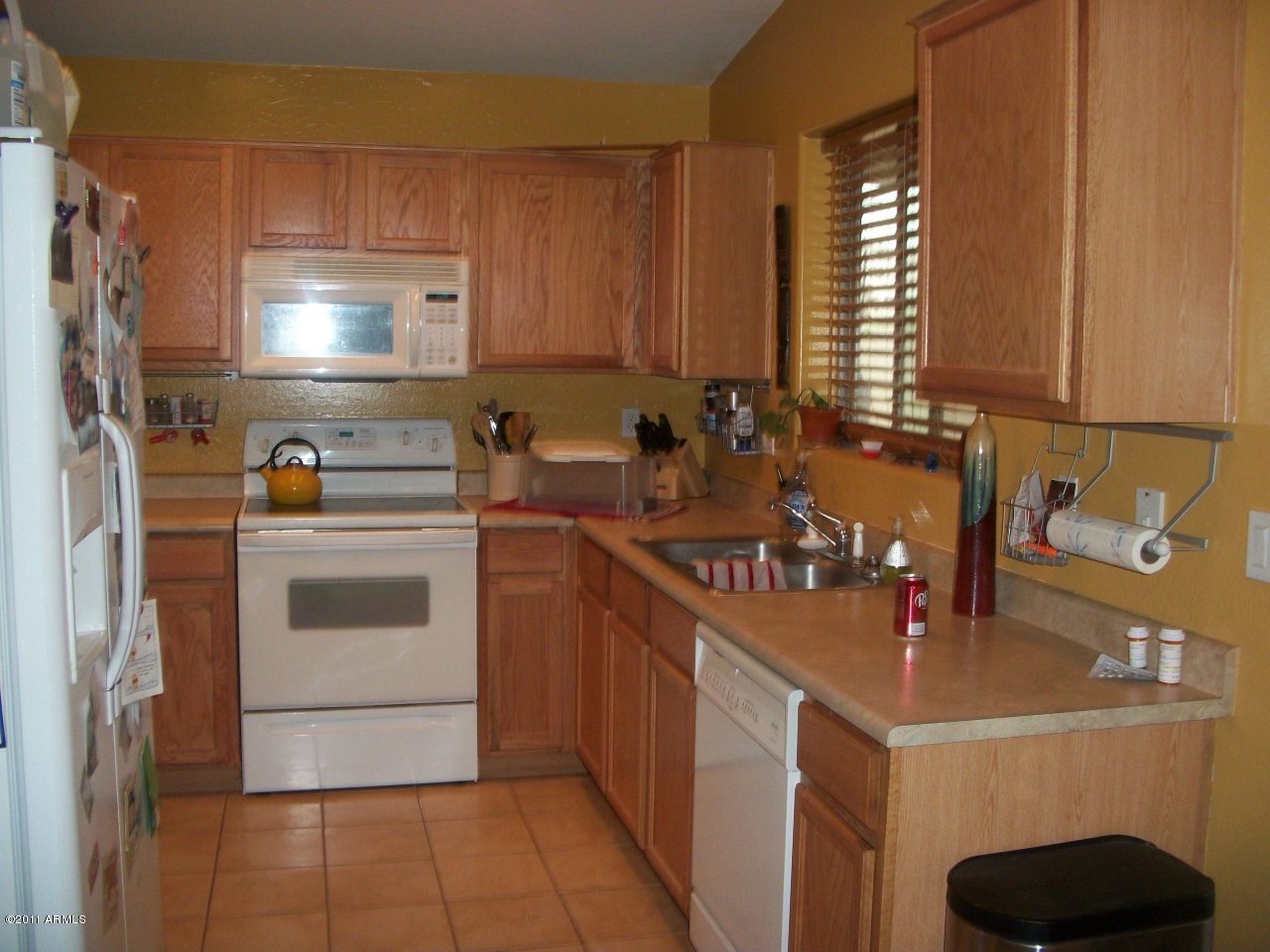 2414 West Apollo Road Phoenix, AZ 85041 - Photo 6 of 8 Nicely equipped kitchen with tile floors
