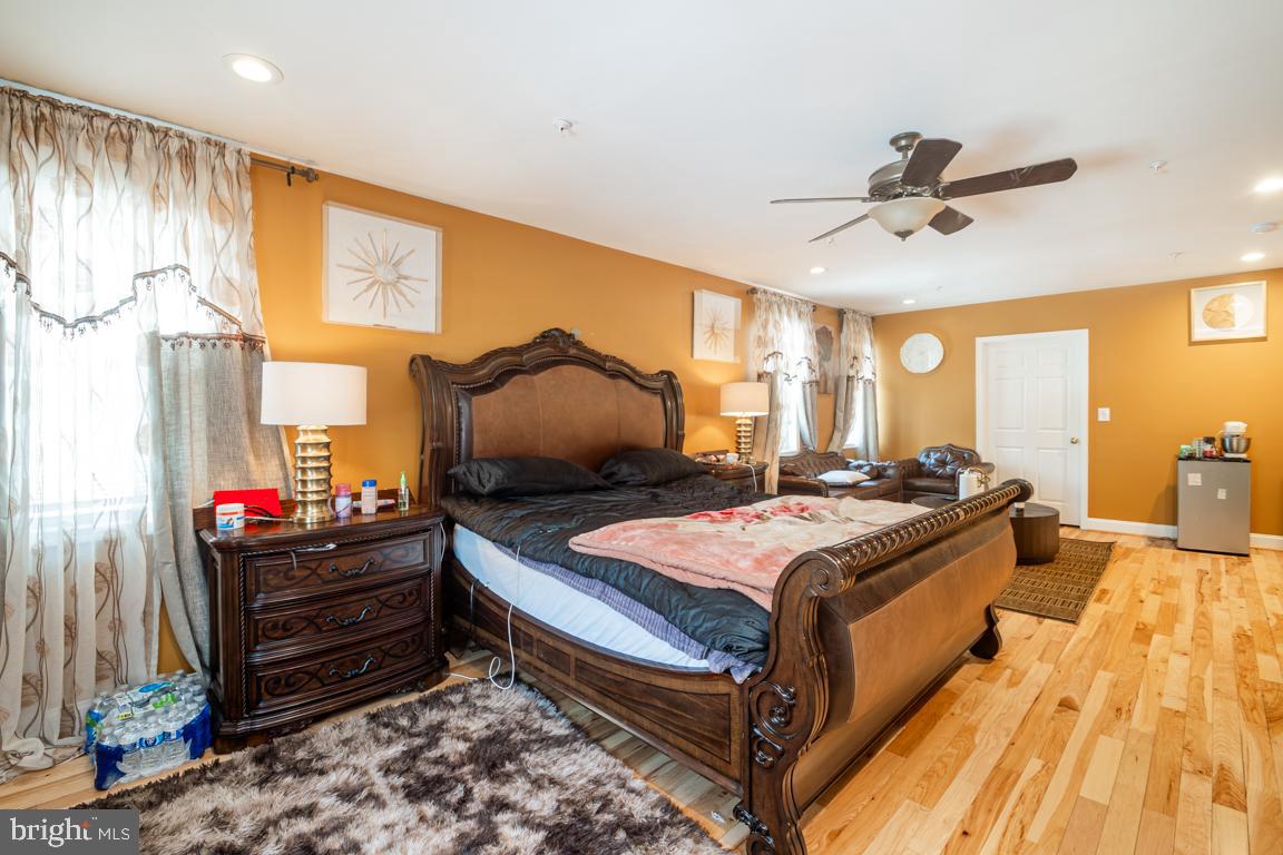 1710 Bargers Road Gambrills, MD 21054 - Photo 19 of 22 a bed room with a bed and a chandelier