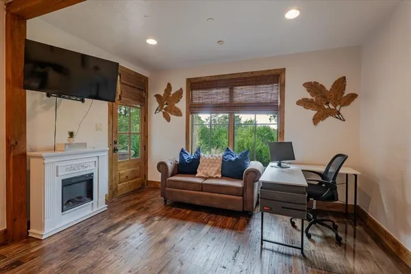 a living room with furniture and a fireplace