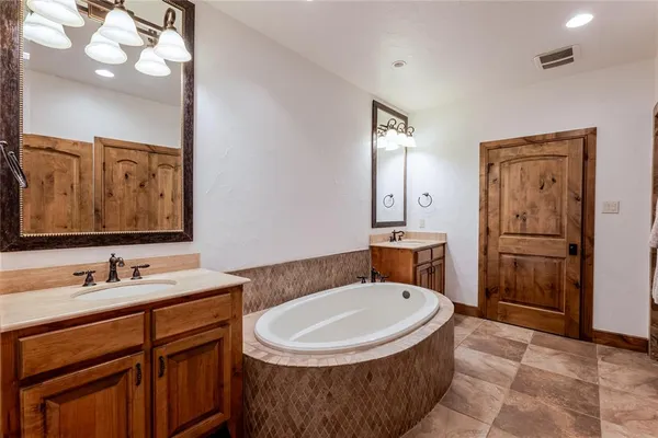 a bathroom with a sink double vanity and a mirror