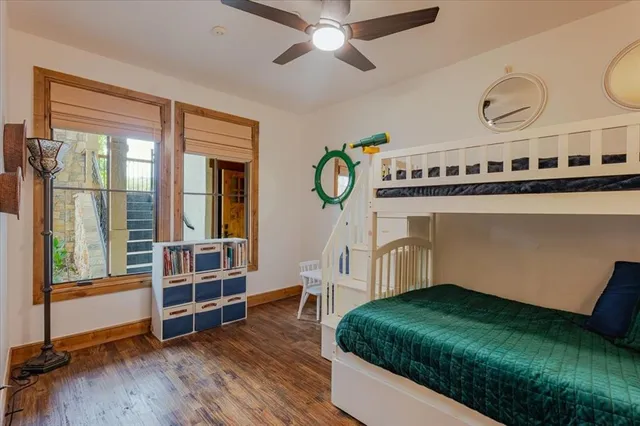 a living room with a bed furniture and a window