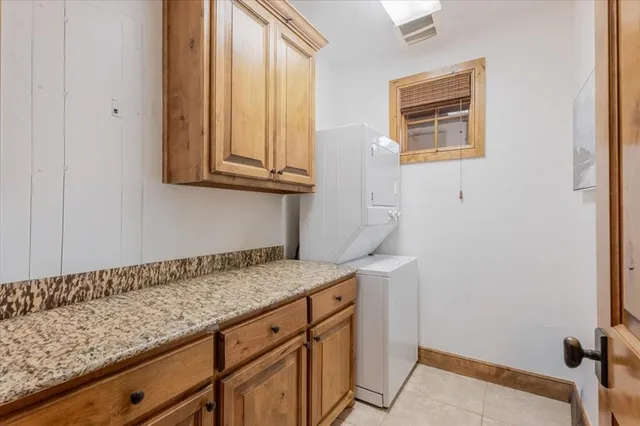 a view of a storage and utility room with a sink