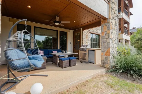 a outdoor space with patio the couches and a dining table with the potted plants