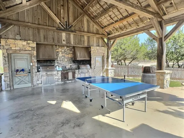 a room with lots of furniture and a chandelier